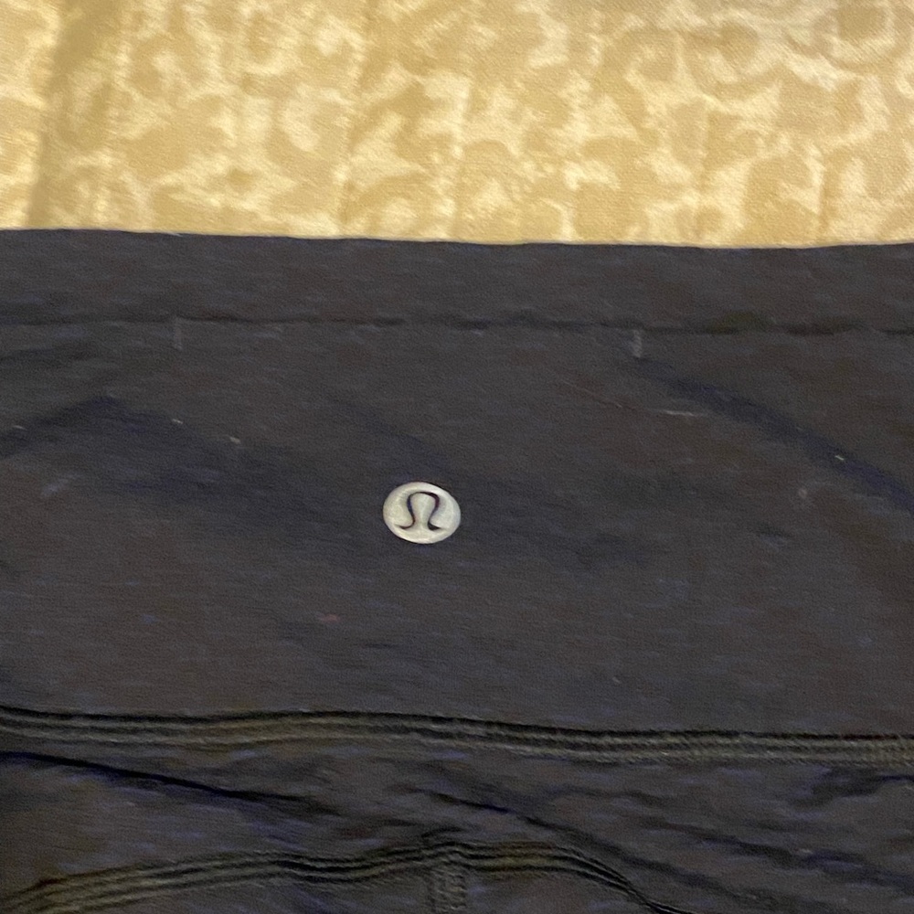 Lululemon size two capri leggings. Navy blue with mesh around bottom. - Picture 3 of 4